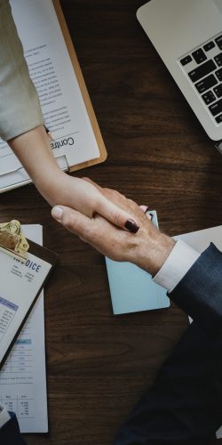 Business people shaking hands together